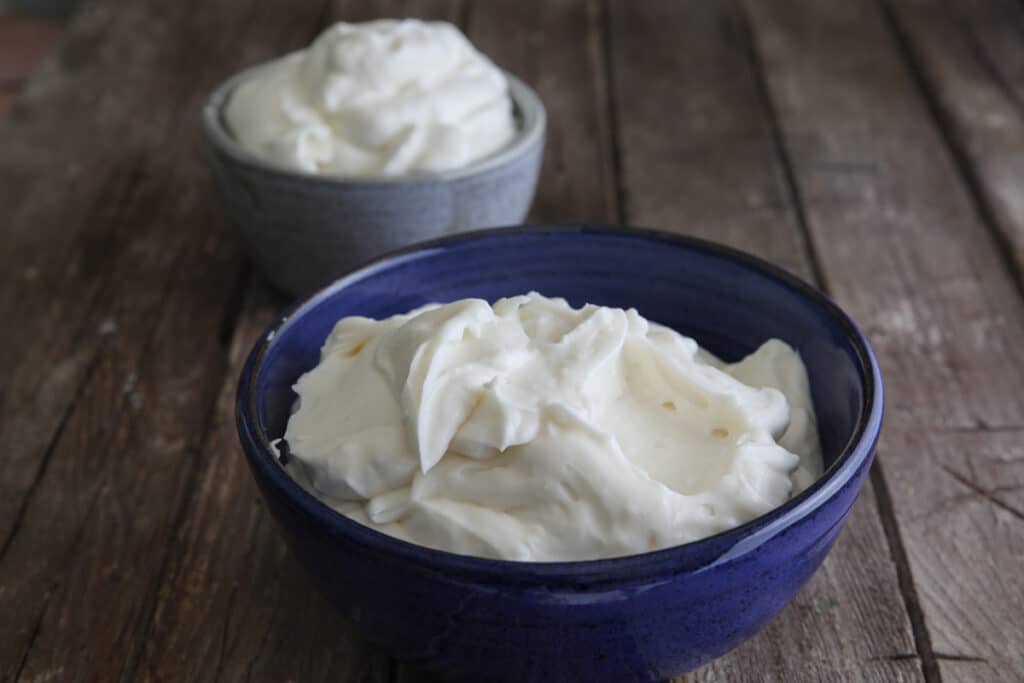 Milk cream in a blue and grey bowl.