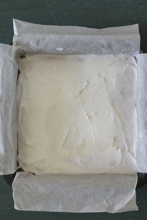 The cream mixture on the baked dough.