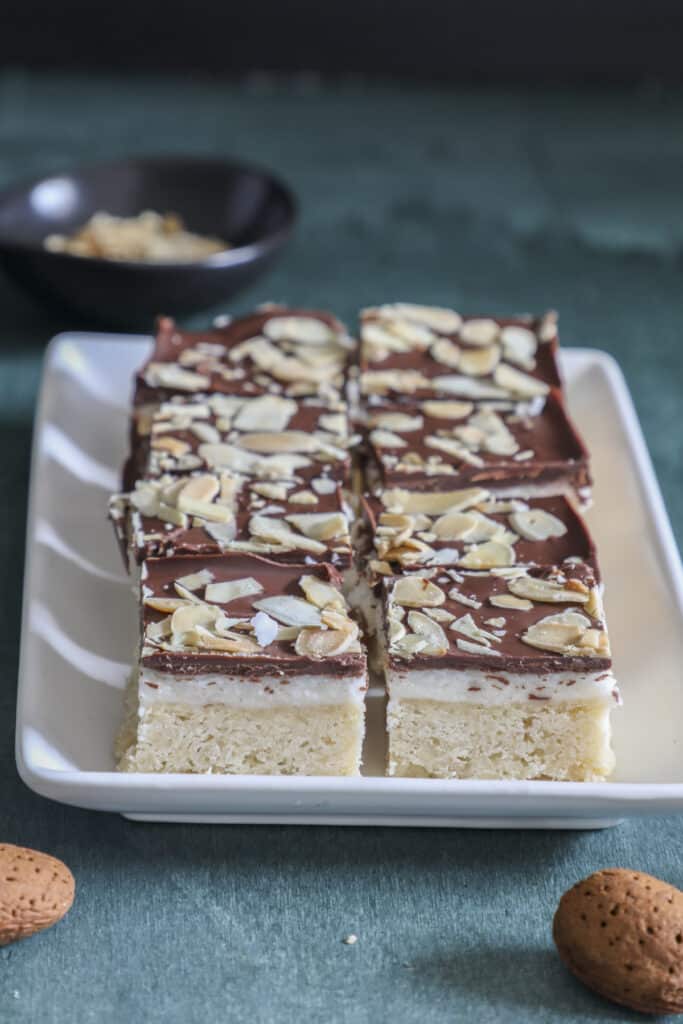 Bar cookies cut on a white tray.