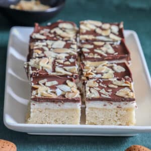 Almond chocolate shortbread bars on a white tray.