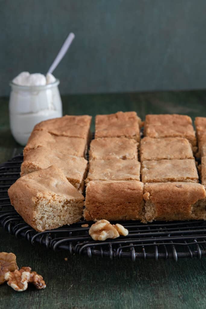 Brown sugar bars cut on a wire rack.