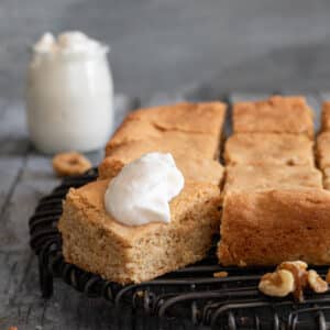 Bars with a dollop of whipped cream on one piece.