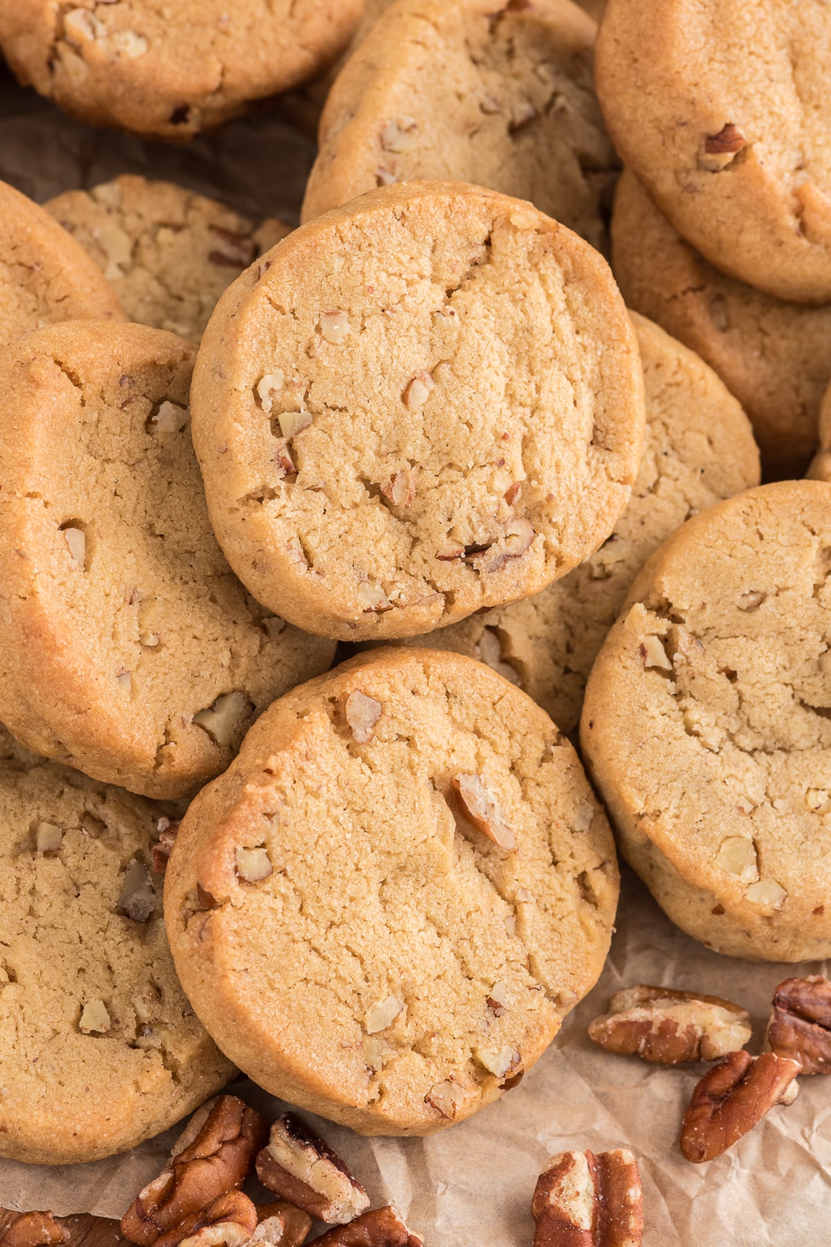 Butter pecan cookies on parchment paper.