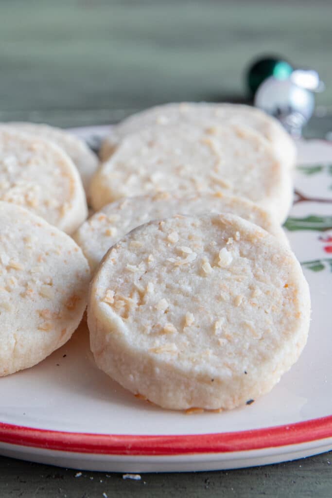 Coconut shortbread cookies on a white plate.