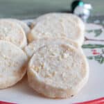 Coconut shortbread cookies on a white plate.