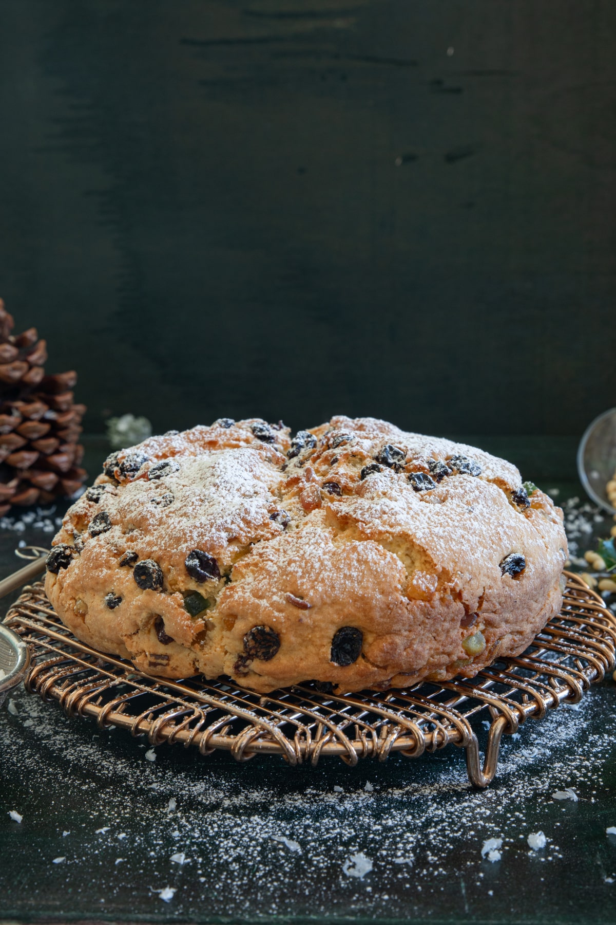 Panettone Genovese on a black wire rack.