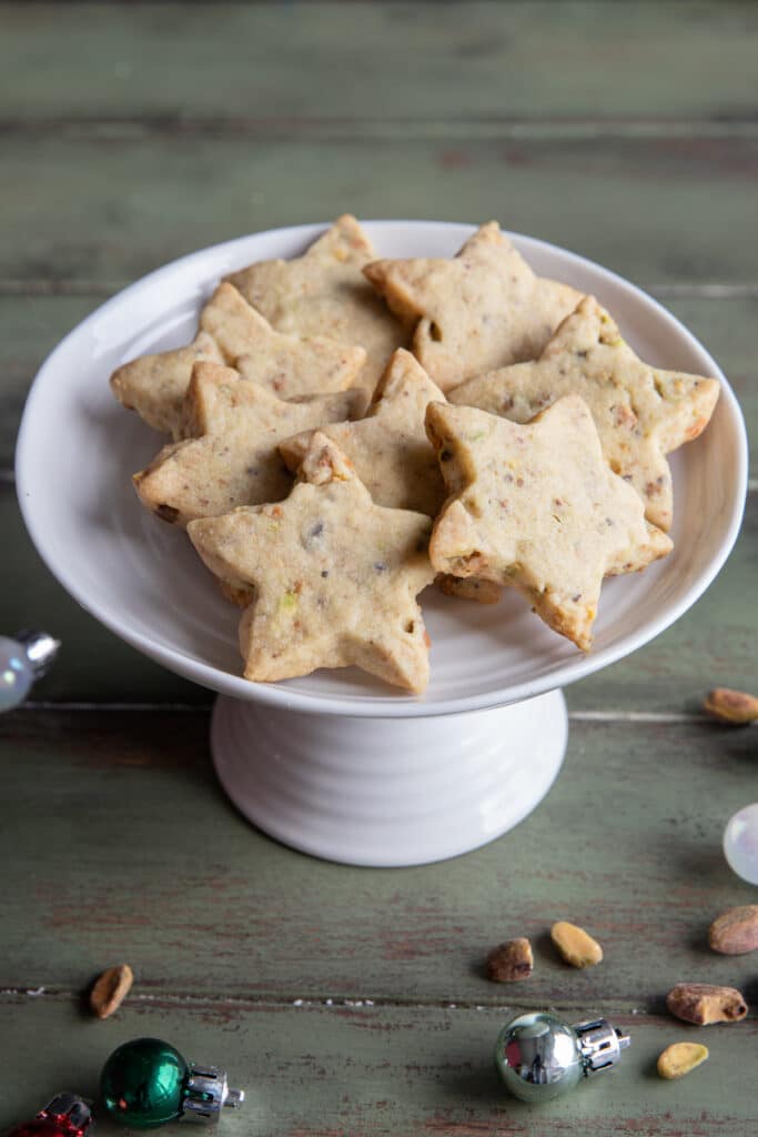 Cookies on a white plate stand.