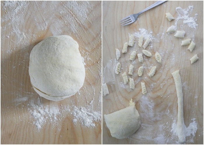 Rolling out the dough to cut to make gnocchi on a wooden board.