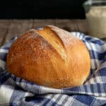 Lievito madre bread on a blue and white napkin.