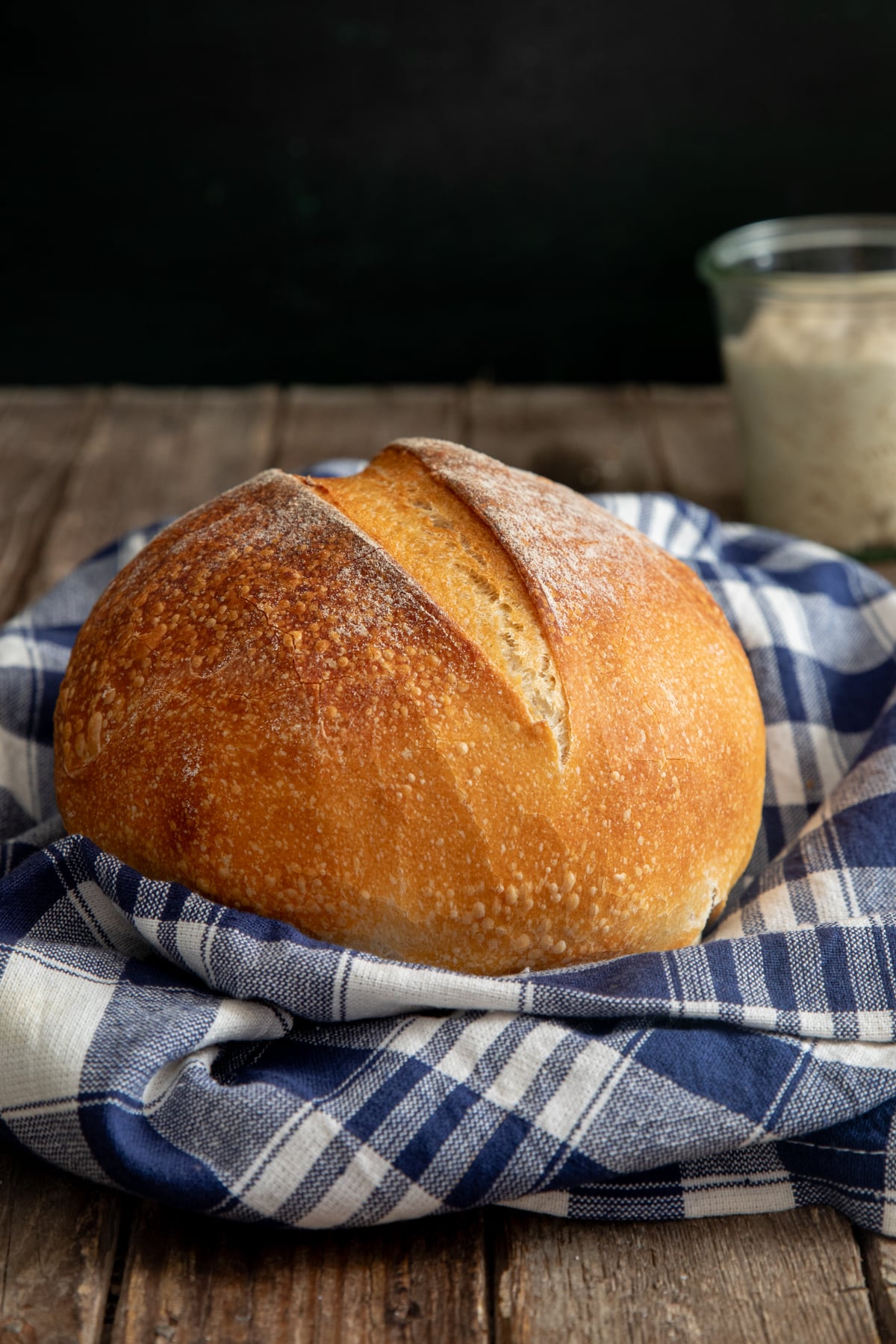 Lievito madre bread on a blue and white napkin.