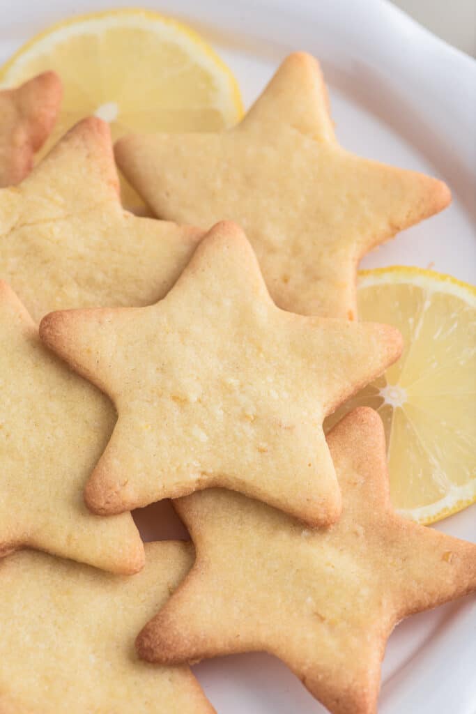 Cut out star cookies on a white plate.