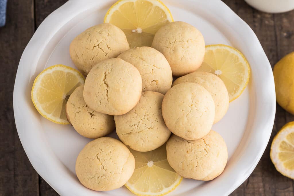 Lemon cookies on a white plate.