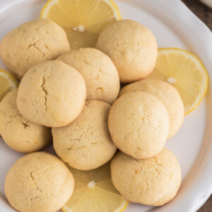 Lemon cookies on a white plate.