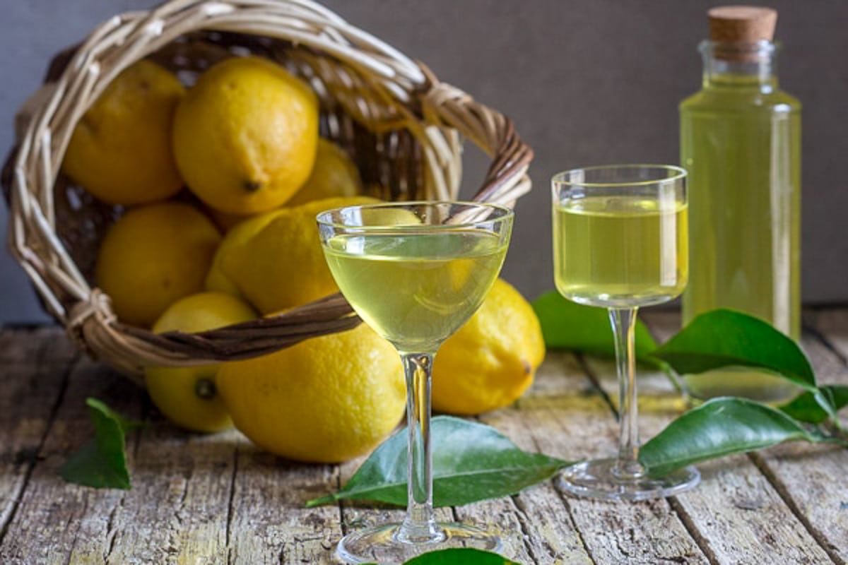 Limoncello in a jar and in two glasses.