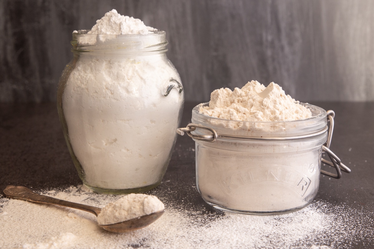 Homemade powdered sugar two ways in glass jars.