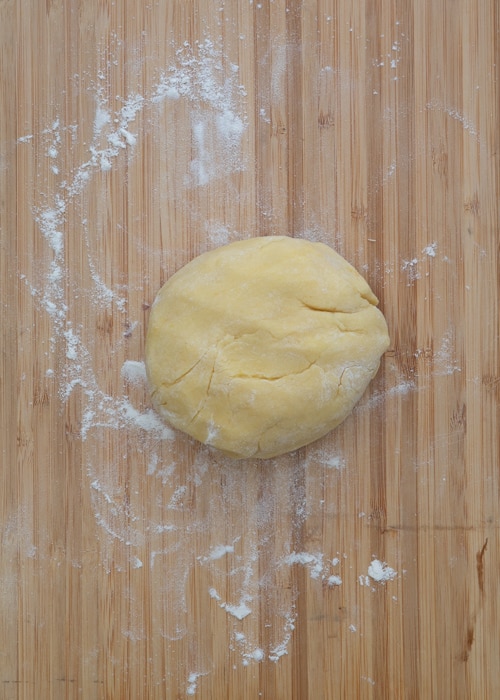 Vanilla cookie dough on a wooden board.