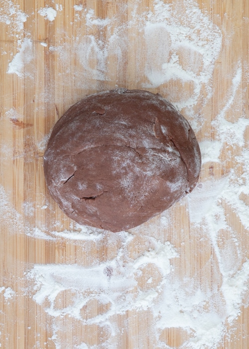 The chocolate dough on a wooden board.