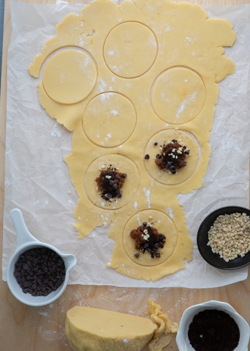 Cutting out the dough and adding the filling.