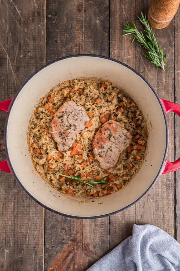 The baked chops and rice in the dutch oven.