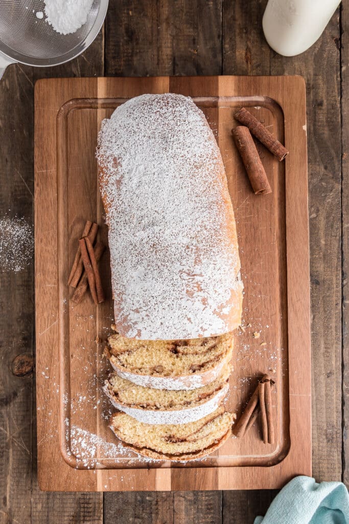 Cinnamon swirl loaf on a wooden board.