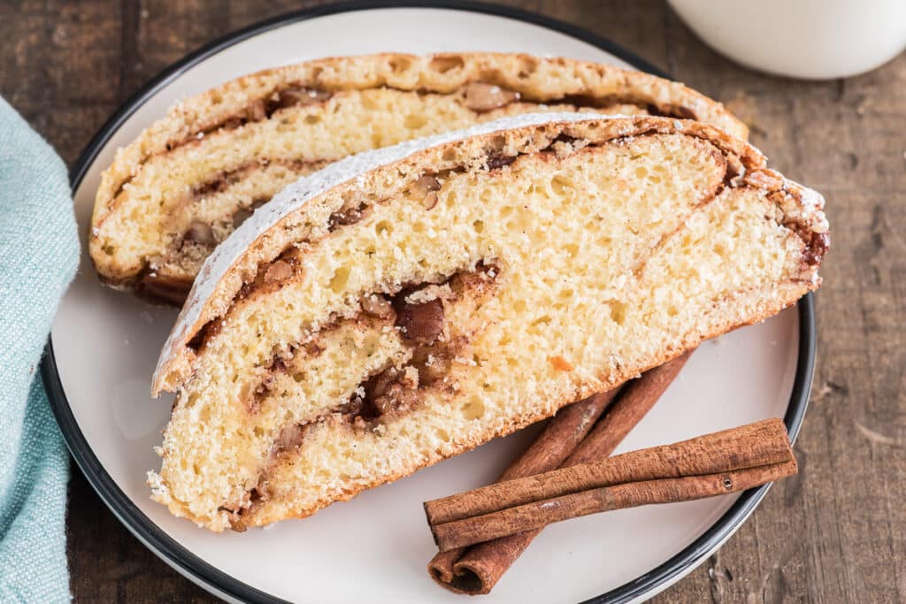 Two slices of cinnamon bread on a white plate.