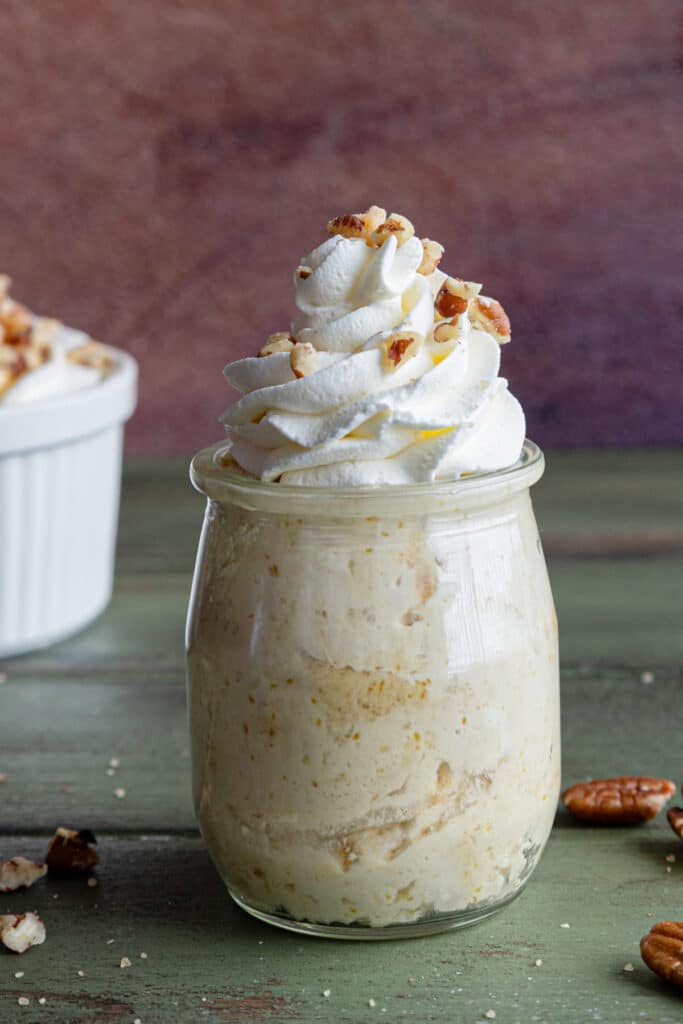 Maple mousse in a white bowl and in a glass jar.