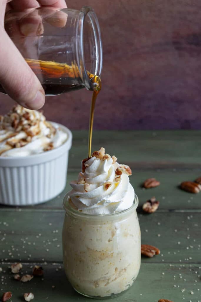 Pouring syrup on top of the mousse.