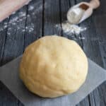 Lievito madre pie dough on parchment paper.