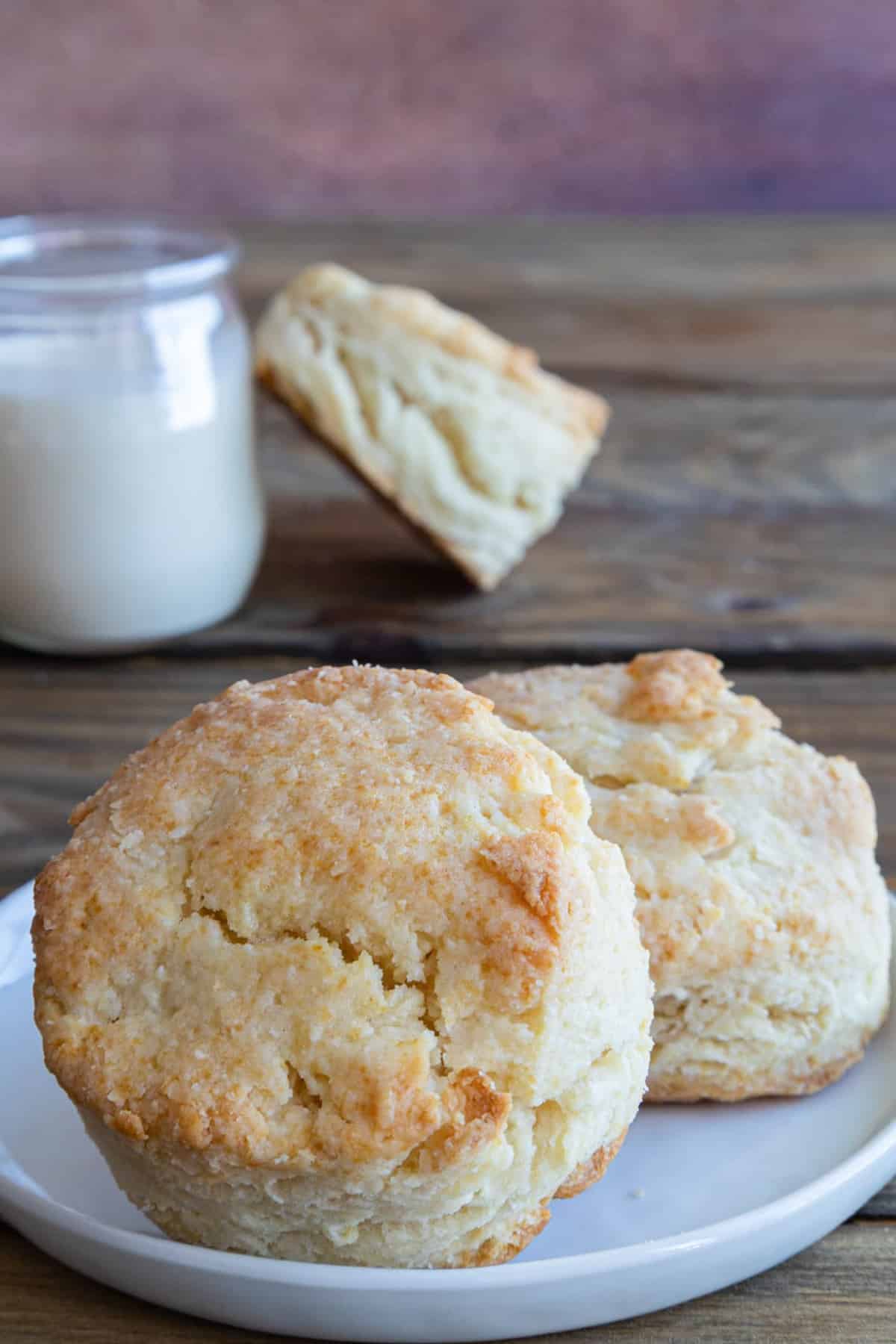 Cream biscuits on a white plate.