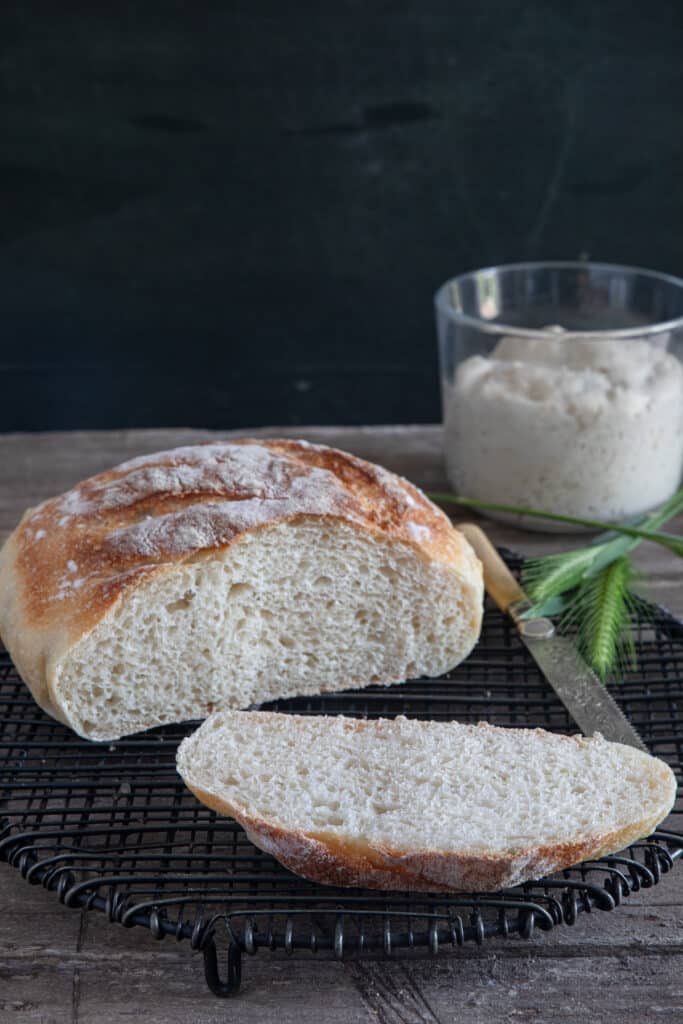 Lievito madre discard bread with a slice cut.