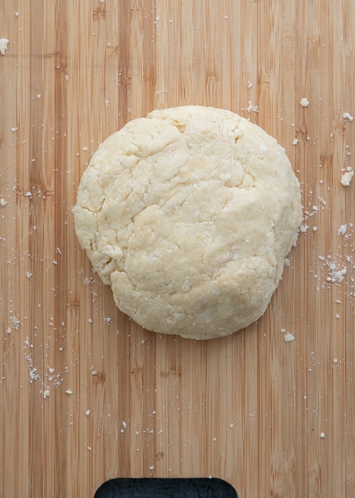 The dough shaped into a disc.