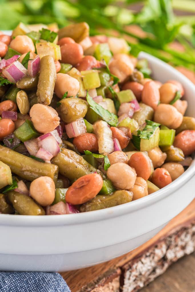 Bean salad in a white bowl.