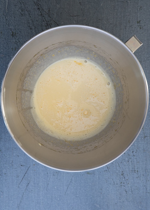 The eggs and sugar beaten in the mixing bowl.