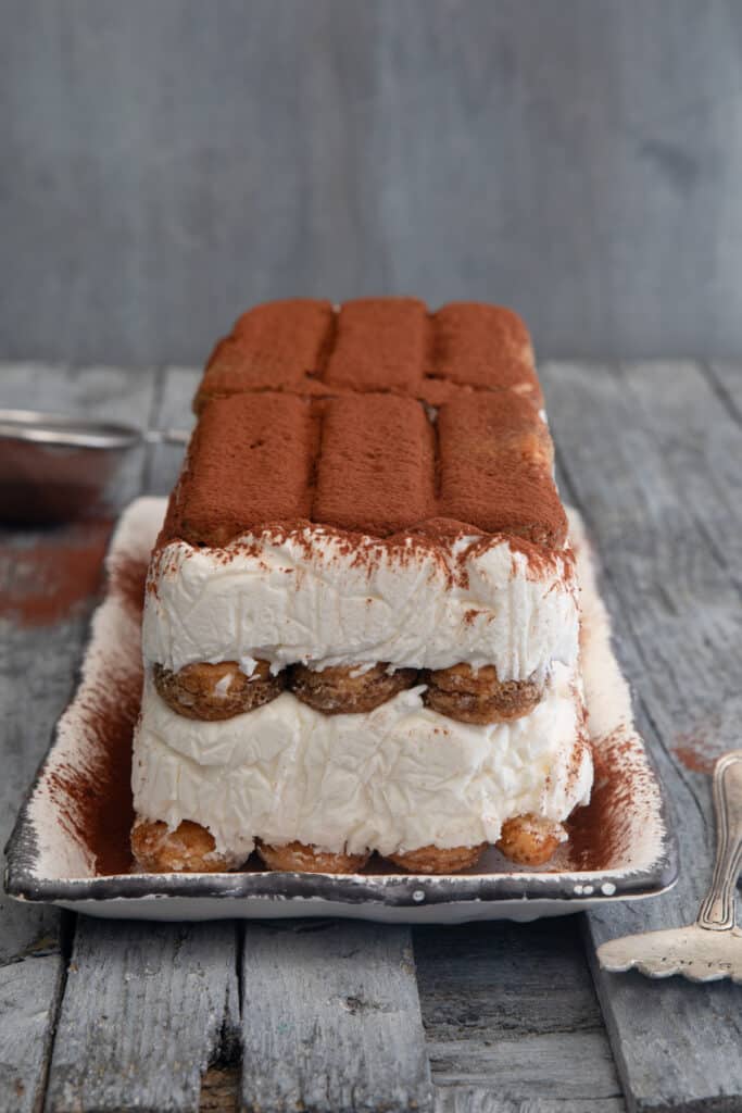 Tiramisu on a white platter.