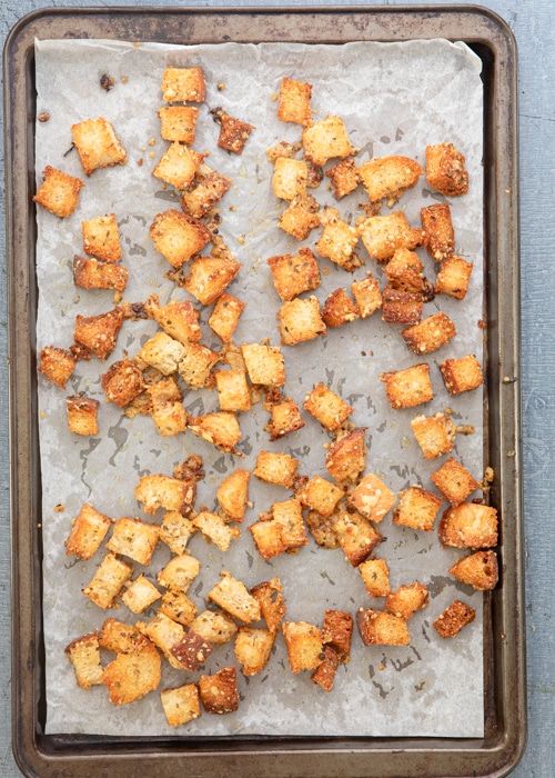 The baked croutons on the baking sheet.