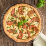 Caprese crostata in a glass pan.