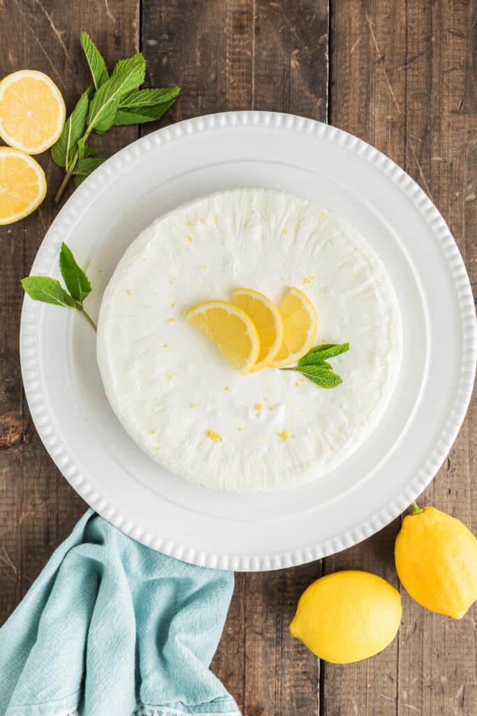 The lemon pie on a white plate.