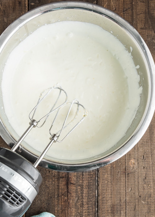 Beating the cream and lemon.