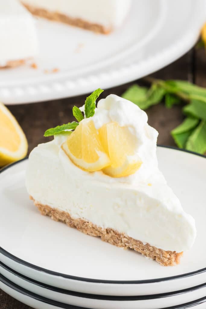 A slice of lemon pie on a white plate.