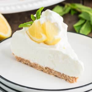 A slice of lemon pie on a white plate.