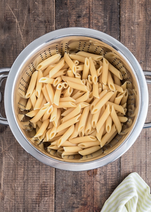 The cooked pasta in the sieve.