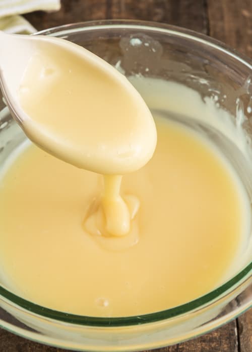 The white chocolate melted in the glass bowl.