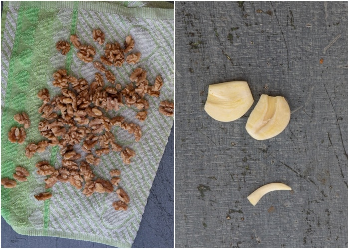 Boiled nuts and on a towel. Garlic cut in half, middle stick removed.
