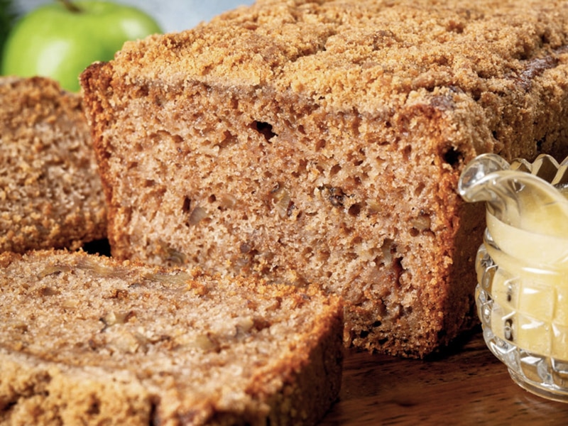 Applesauce bread with a slice cut.