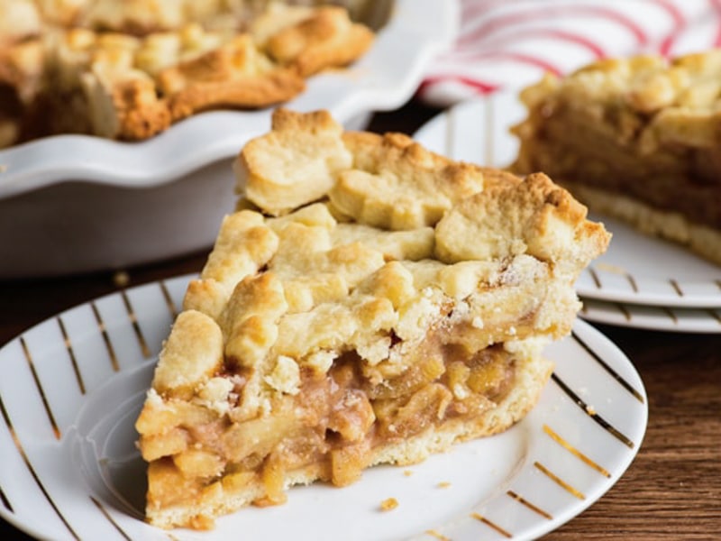 A slice of Italian apple pie on a white plate.