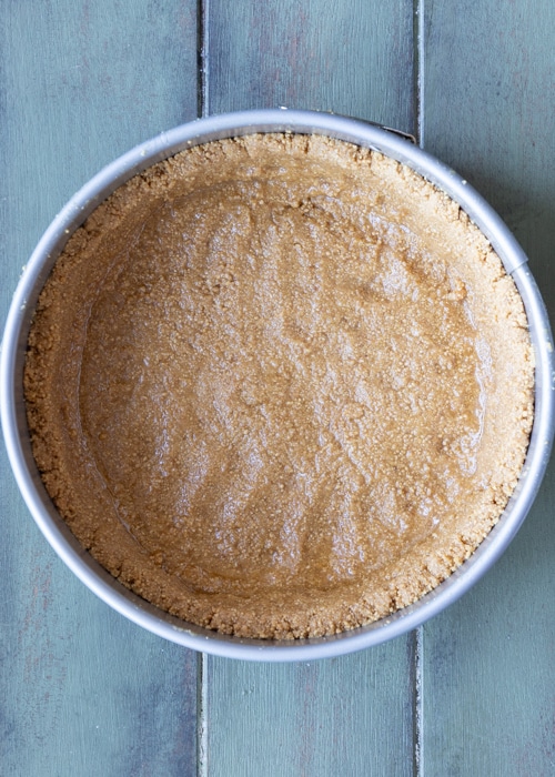 The crumb base in the cake pan.