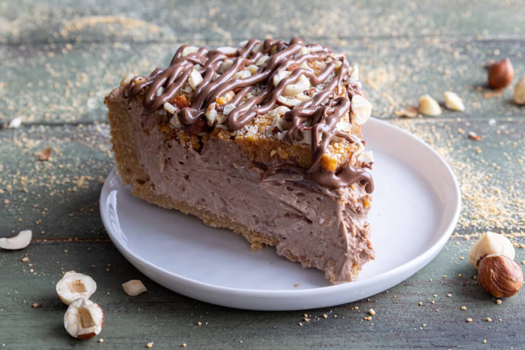 A slice of cake on a white plate.