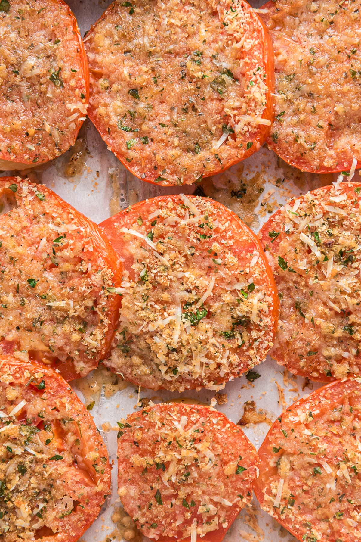 Tomato and potato bake on a baking tray.