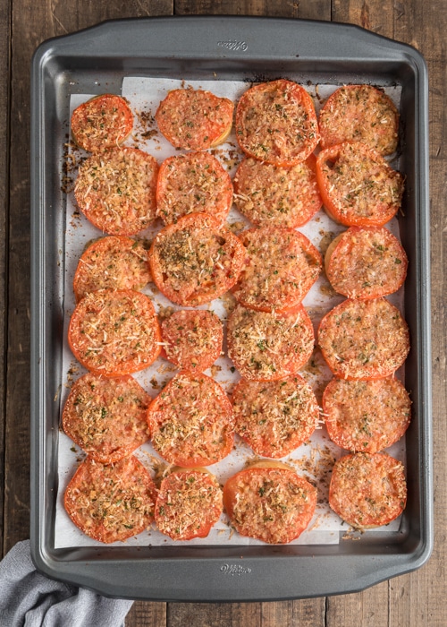 The baked tomatoes on a baking sheet.