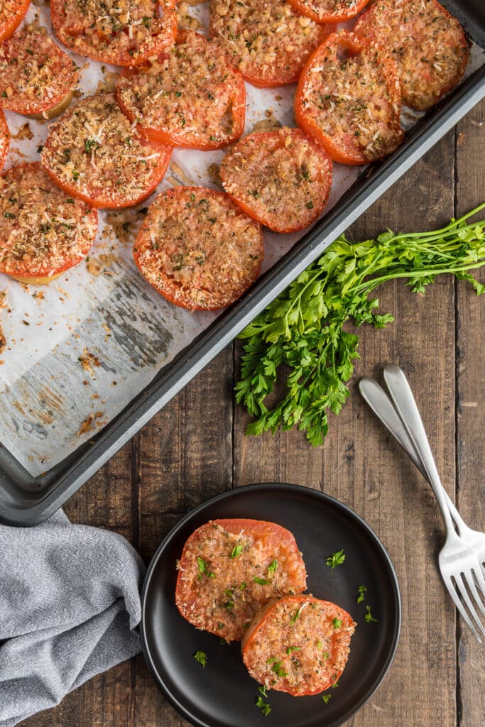 Potato and tomato bake on a baking tray.